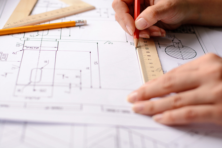Architect sketching a construction project, view from the top