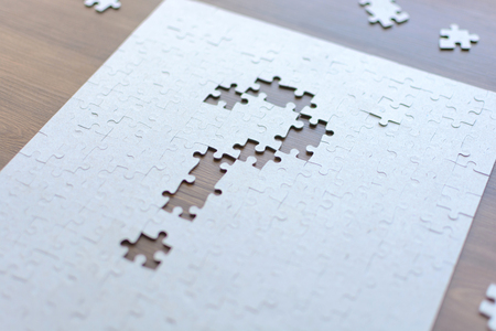 Question mark in the form of puzzles. Task and implementation. Business conceptsの写真素材