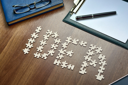 notebook, tablet and puzzles on your desktop