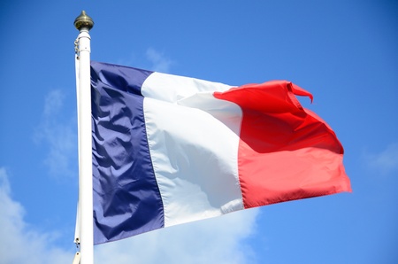 French flag against the clear blue skyの写真素材