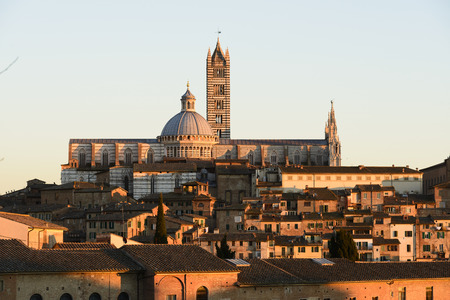 Cathedral in the old town of medieval Siena at sunset.の写真素材