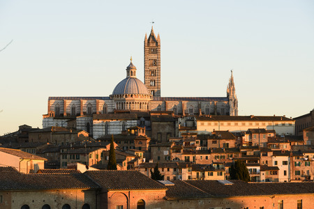 Cathedral in the old town of medieval Siena at sunset.の写真素材