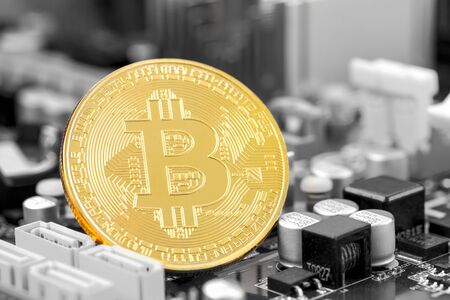 Close up circuit board with bitcoin and microchips. Bitcoin is Electronic currency Internet finance