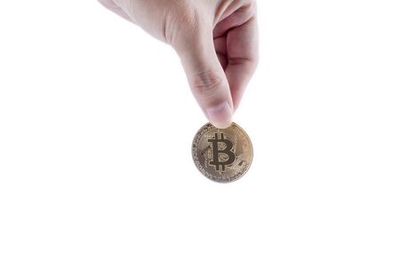 Man hand holding golden bitcoin isolated on white backgroundの写真素材