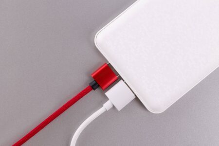 Power bank or Battery bank isolated and USB Cable for charging mobile devicesの写真素材