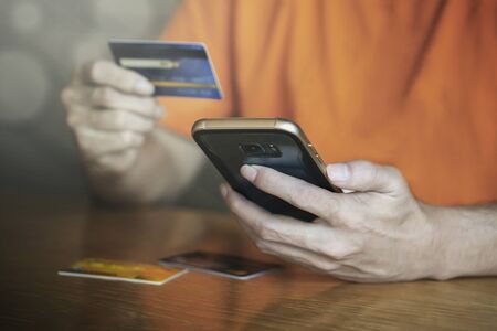 Shopping online payment with credit card , man using mobile smartphone ,  business e-commerce and...