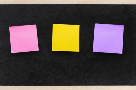 Empty note paper sheet on black chalkboard surface, Copy space for text memory story of life in note...