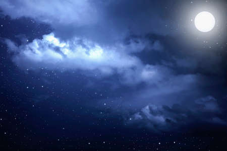 Starry night sky with stars and moon in cloudscape backgroundの写真素材