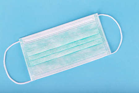 Medical mask for protection corona virus with rubber ear straps to cover the mouth and nose isolated...
