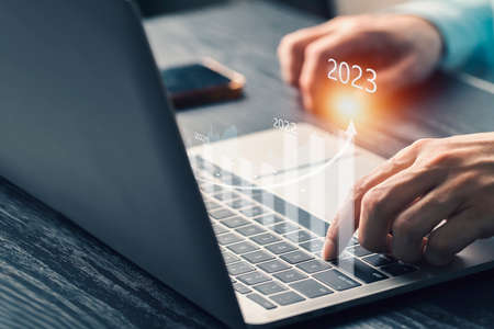 Concept of business finance and investment 2023 , Stock Market Investments growing with businessman investor 2023, management of Business finance background.の写真素材