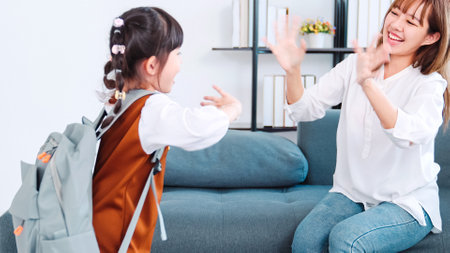 Young asia mother helping her daughter get ready for school . Asian kids student going first day at...