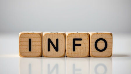 An information word spelled with wooden blocks on reflective surface, simple and clear concept of data or knowledgeの素材