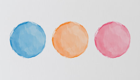 A three watercolor pastel circles in blue, orange, and pink colors on white background with soft textureの素材