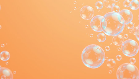 Transparent bubble cluster floating on soft orange background with light reflections creating calm and airy atmosphereの素材