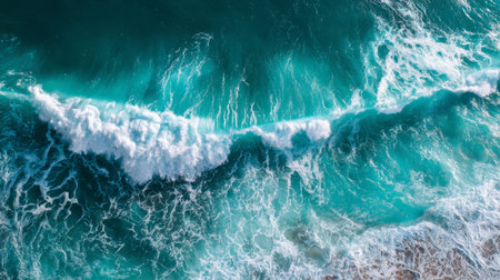 Ocean wave with white foam crashing in turquoise water, creating dynamic and refreshing natural seascape viewの素材
