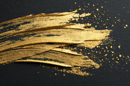 Gold paint abstract texture brushstroke luxury black background metallic creative modern elegant artistic shiny decorative designの素材