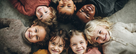 Joyful children circle diverse kids happy faces friendship together playful smiling group portrait cozy sweaters autumn vibesの素材