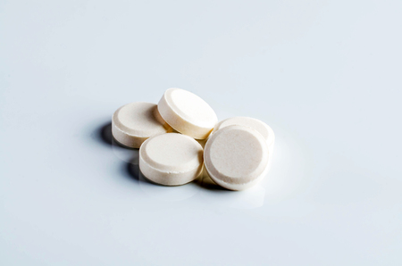 Some pills on white table.の写真素材