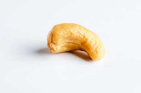 Closeup grilled cashew nut isolated on white background.の写真素材