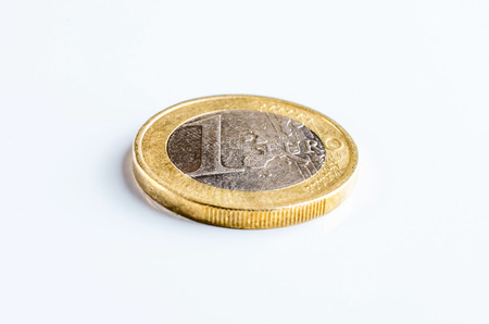 One Euro coin isolated on white background from sideal wiev.の写真素材