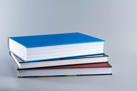Back to school. Three books on gray background.