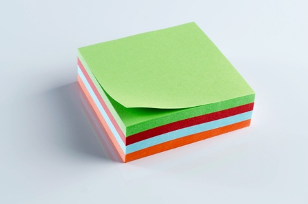 Colorful notepaper on white table.の写真素材