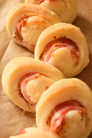 "Bacon epi" on paper.
Refreshing morning atmosphere, freshly baked bread on the table.の写真素材