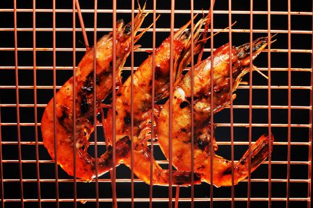 Barbecued shrimp in a cooper rack ready to eat.の写真素材