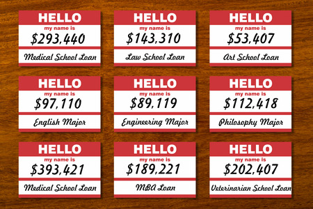 Student loan debt listed on table with name tags.の写真素材