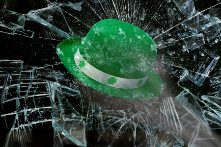 Saint Patrick's Day  green  hat through broken window.の写真素材