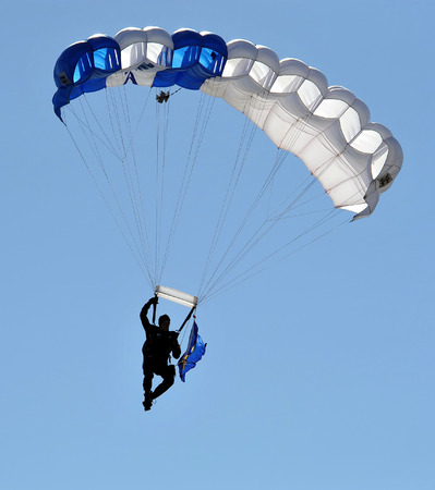 Parachutist in the deep blue sky.の写真素材