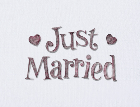 Just married on white art board with room for your type.の写真素材