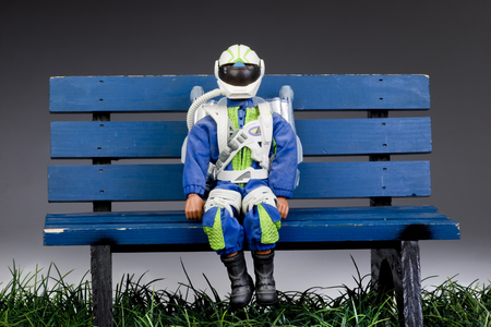 Rocket man on a blue park bench.の写真素材
