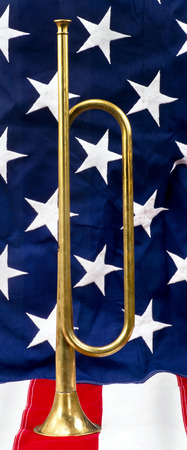 Brass bugle on a American flag.の写真素材