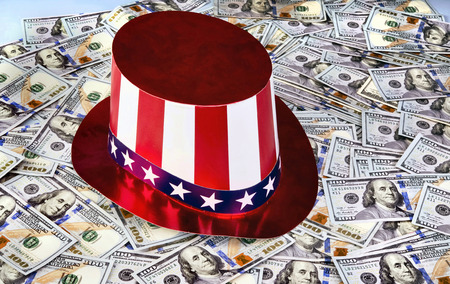 New American Hundred dollar bills under Uncle Sam Hat.