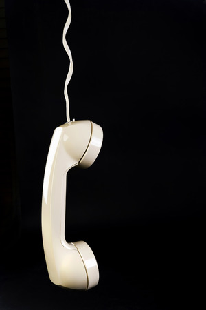 Telephone hanging on cord with room for your type.の写真素材