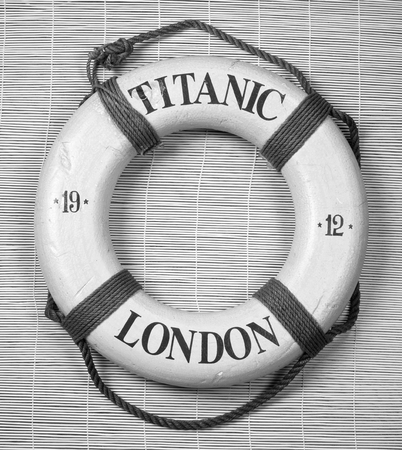 Titanic lifesaver with date of 1912 and London on it in black and white.の写真素材