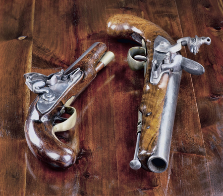 18th century English flintlock pistols.