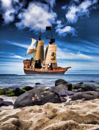 Pirate ship next to ocean beach.の写真素材