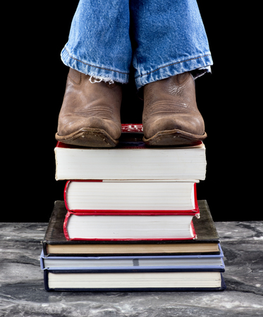 Stepping up high on schools books.の写真素材