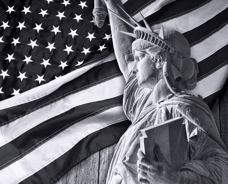 Statue of liberty and American flag in black and white.の写真素材