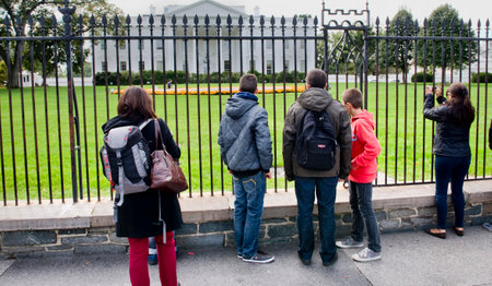 Washington, DC- Oct. 2014   People looking at White House through fence in Washington, DC.のeditorial素材