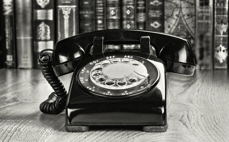 Old style rotary telephone from the 1960's in black and white.の写真素材