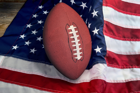 American football on American flag, old glory.の写真素材