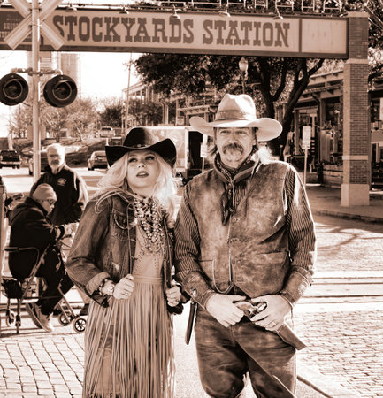Fort Worth,Texas, Jan.4,2020 - Fort Worth Stockyards  cowgirl and cowboy standing next to the...