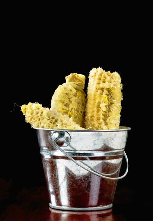 Bucket full of corn cobs for use in shortage of Toilet paper.の写真素材