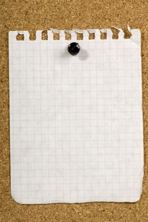Blank piece of old paper pinned to a bulletin board ready for your text to be added to it.の写真素材
