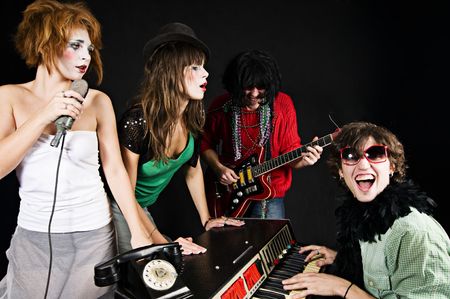 Music band of four youngsters performingの写真素材