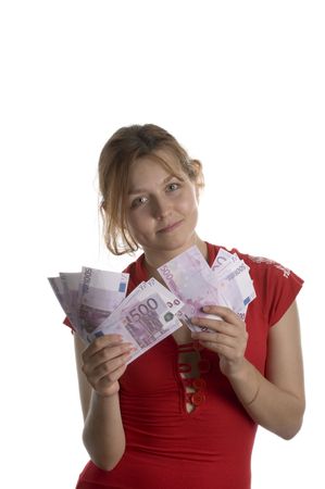 Red haired girl showing bunch of moneyの写真素材