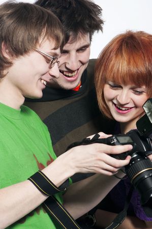 Photographer showing models image on the back of his digital slr.の写真素材